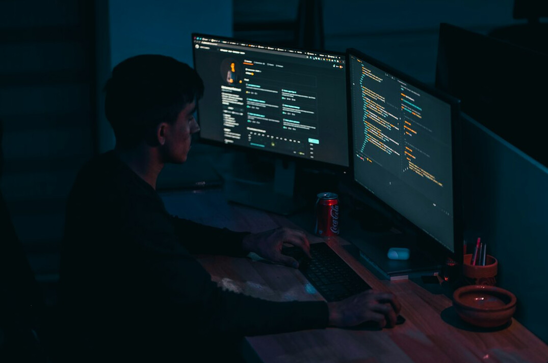 person writing code notes