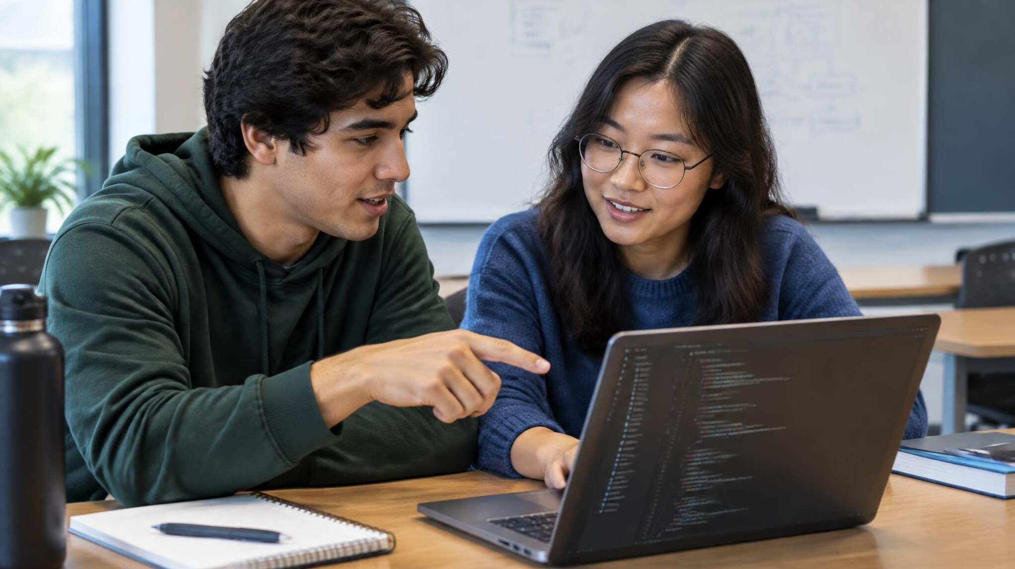 two people collaborating on code